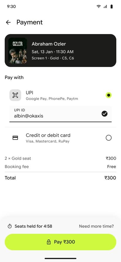 The 2026 payment screen: a booking summary, UPI first, then card, and a seat hold timer above the pay button